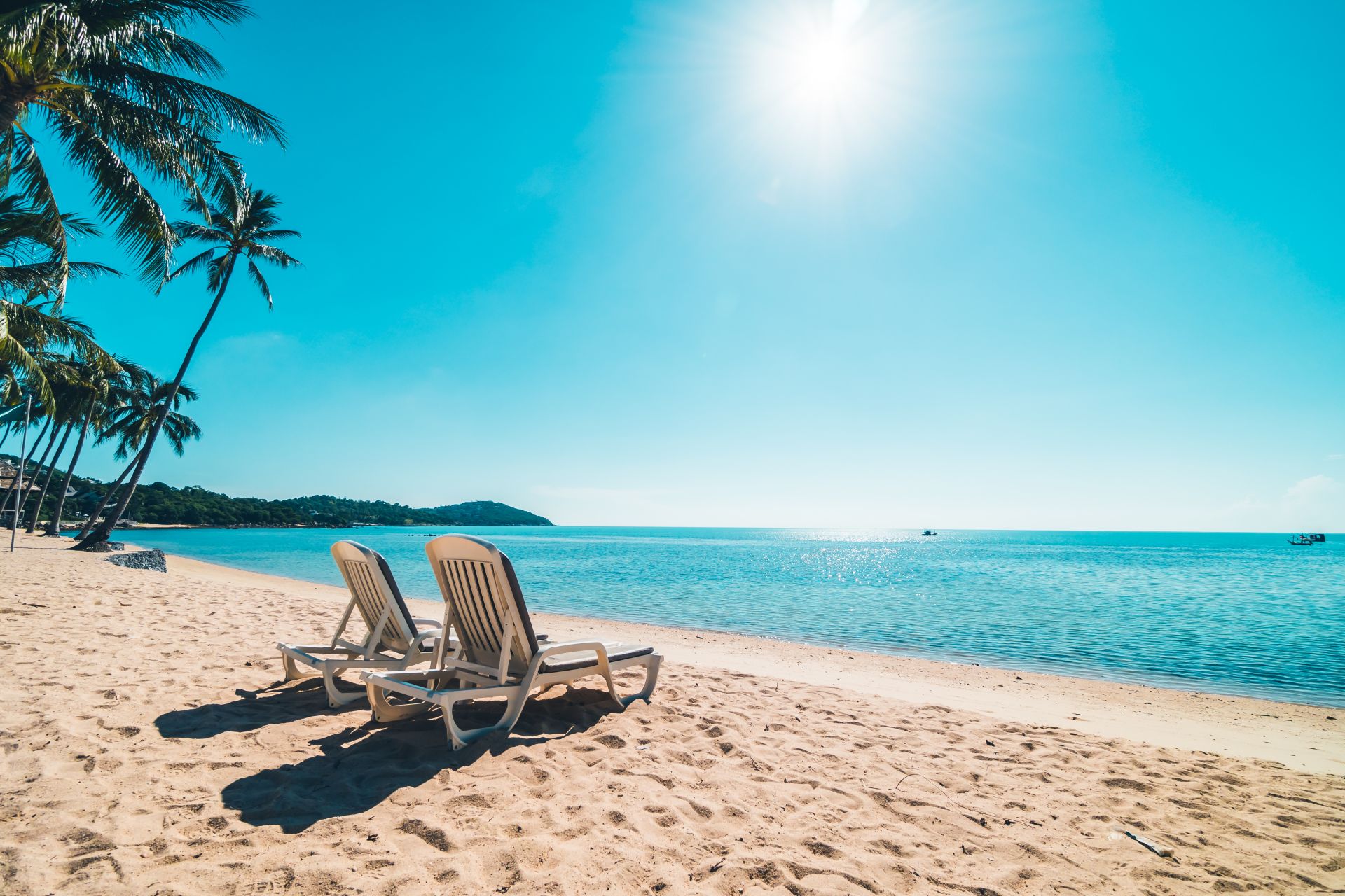 beautiful-tropical-beach-sea-with-chair-blue-sky.jpg